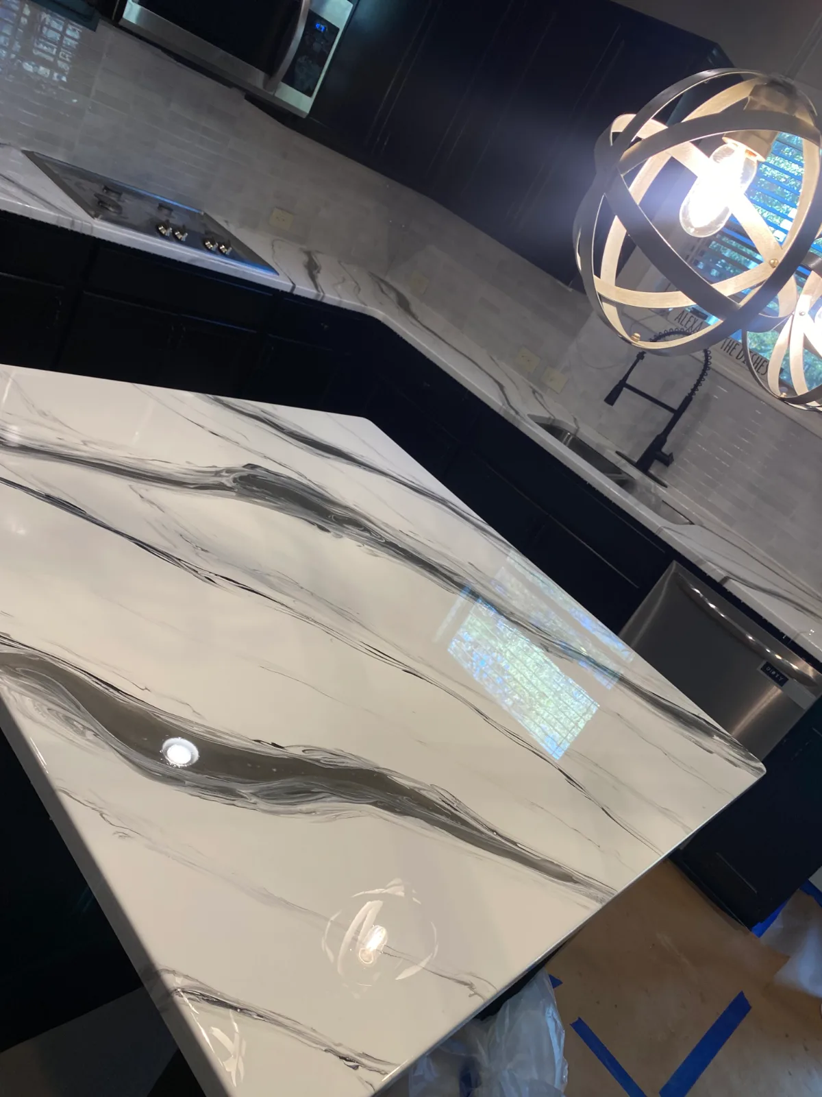 Glossy white and black marble-swirl epoxy kitchen countertop